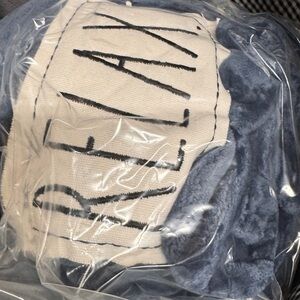 50” x 60” NIP Blue soft blanket w/white patch - says “RELAX”